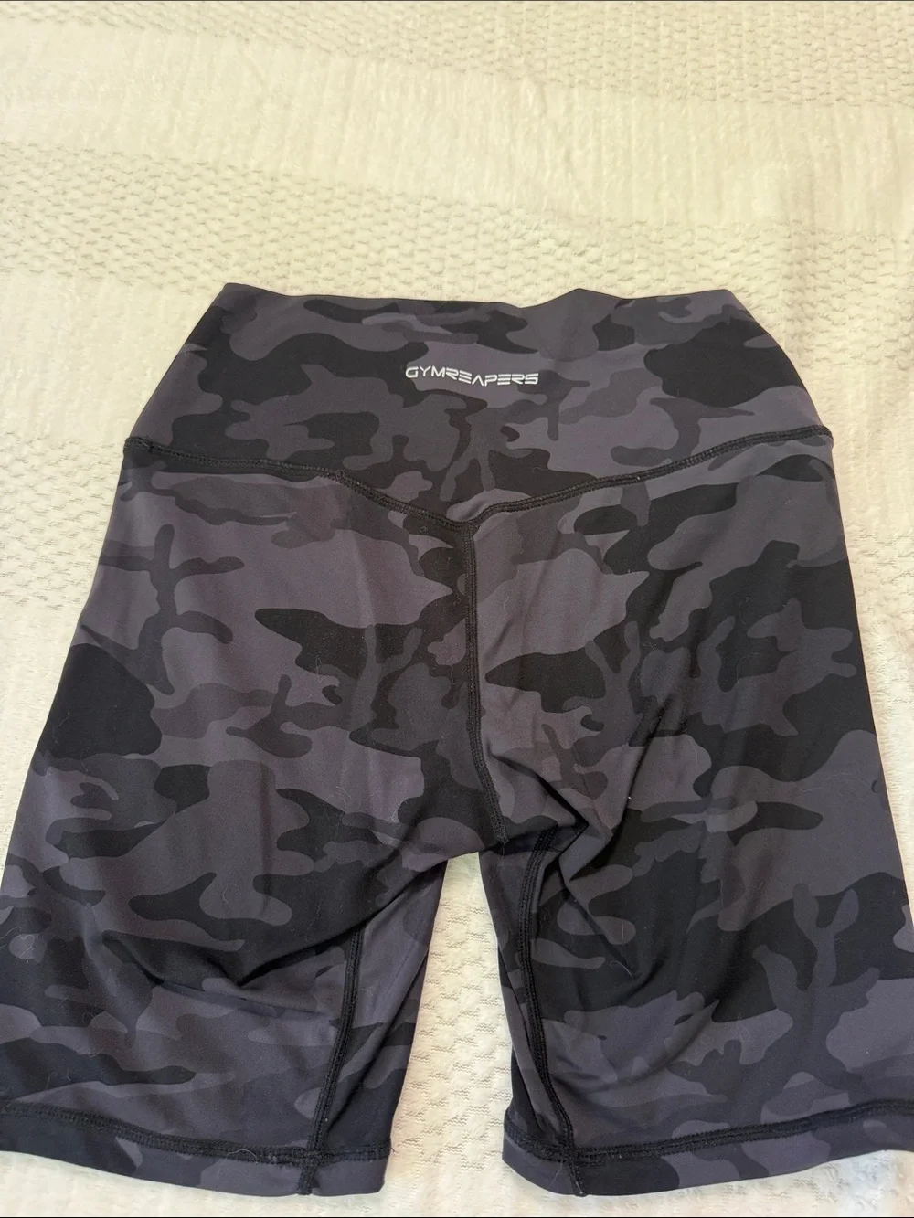 High-Rise Black Camo Bike Shorts with Subtle Skull Accent